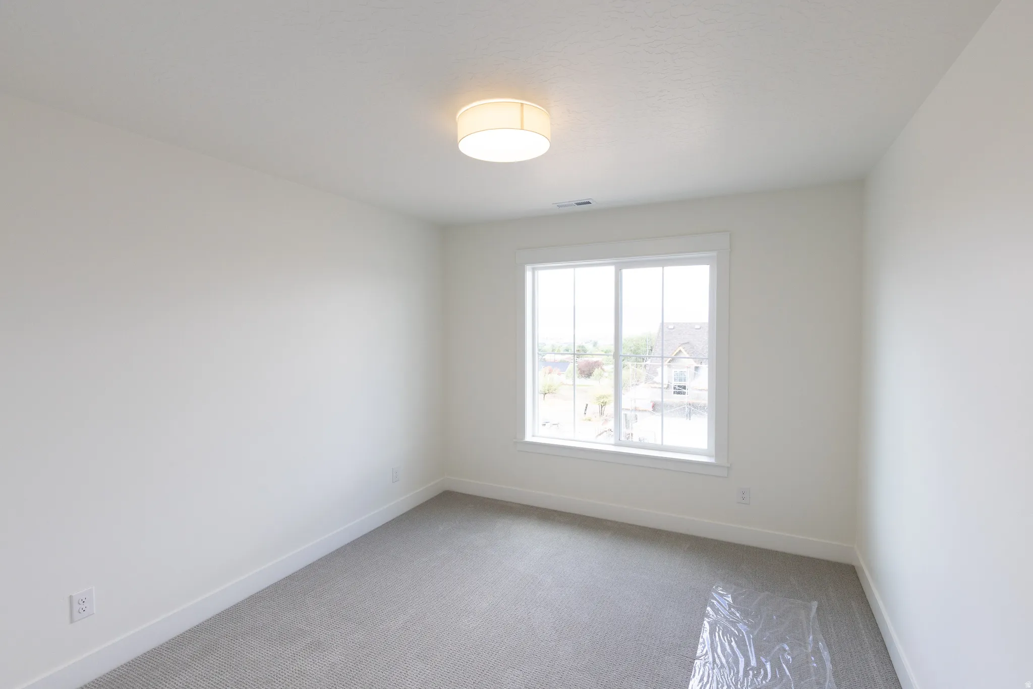 Neutral carpeting and white walls