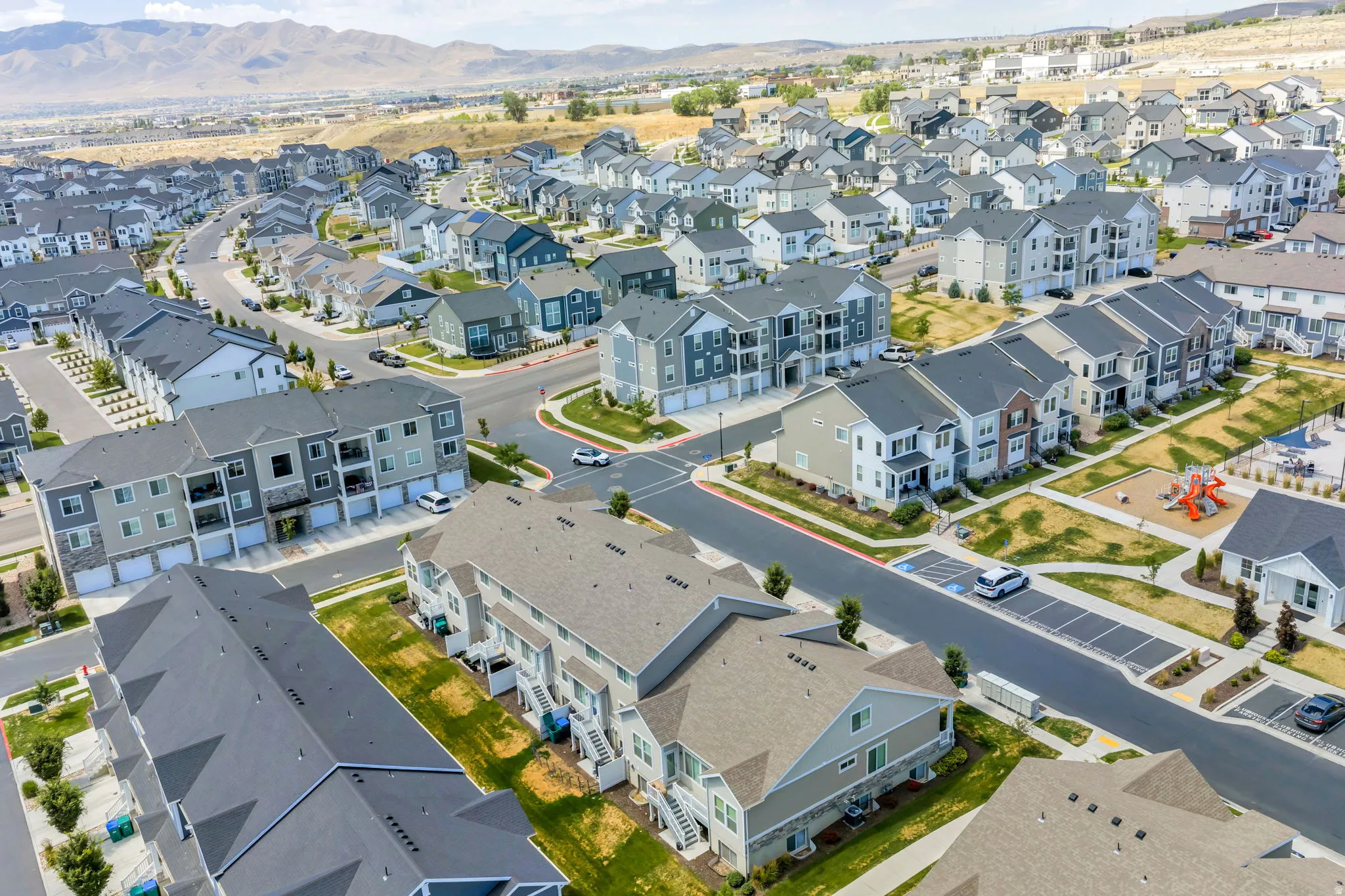 Expansive residential community featuring a variety of multi-level homes with diverse exterior finishes