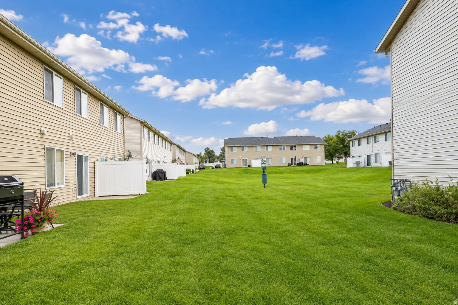 Expansive green space featuring a manicured lawn