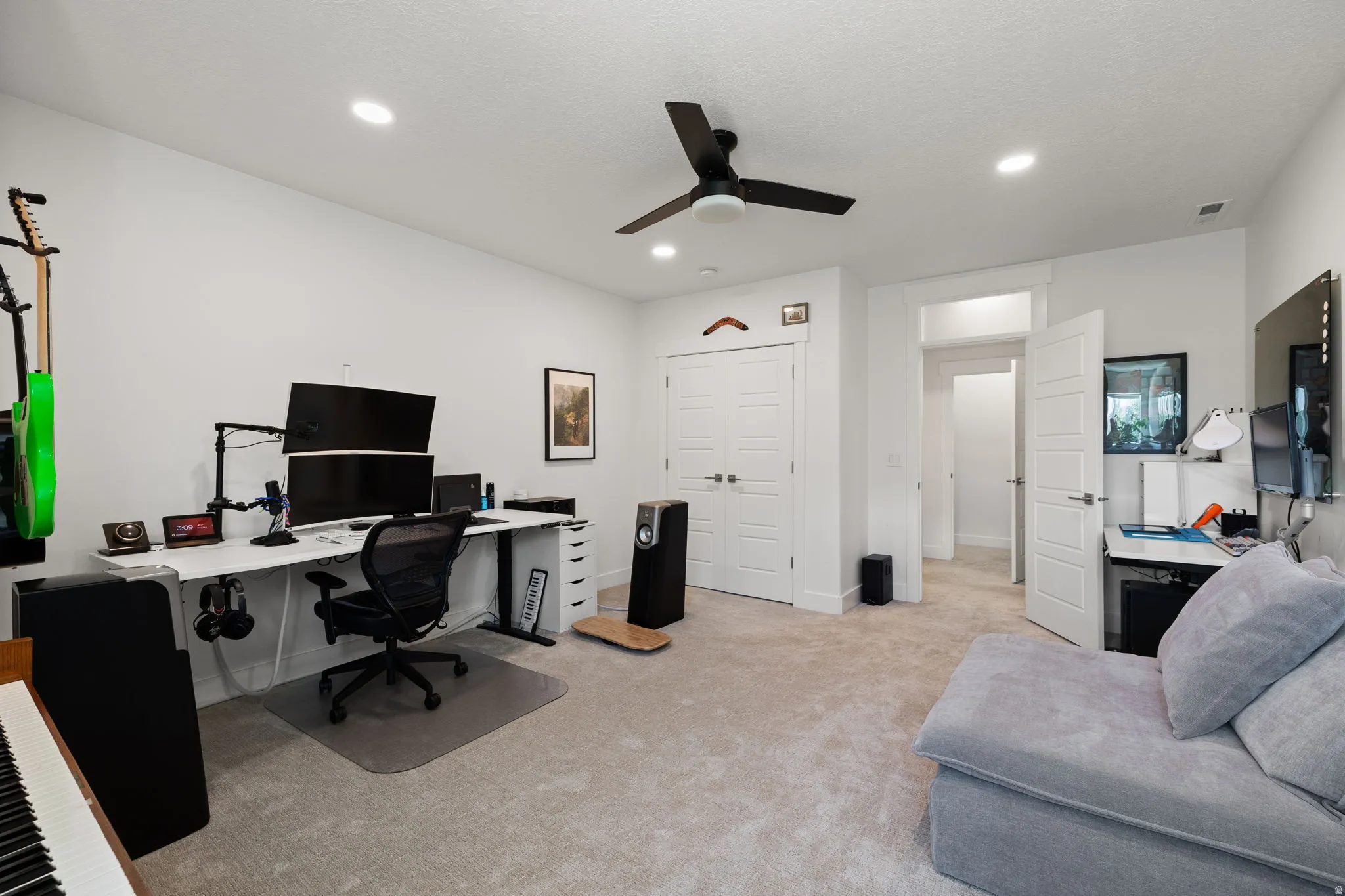 Carpeted room with recessed lighting and a ceiling fan