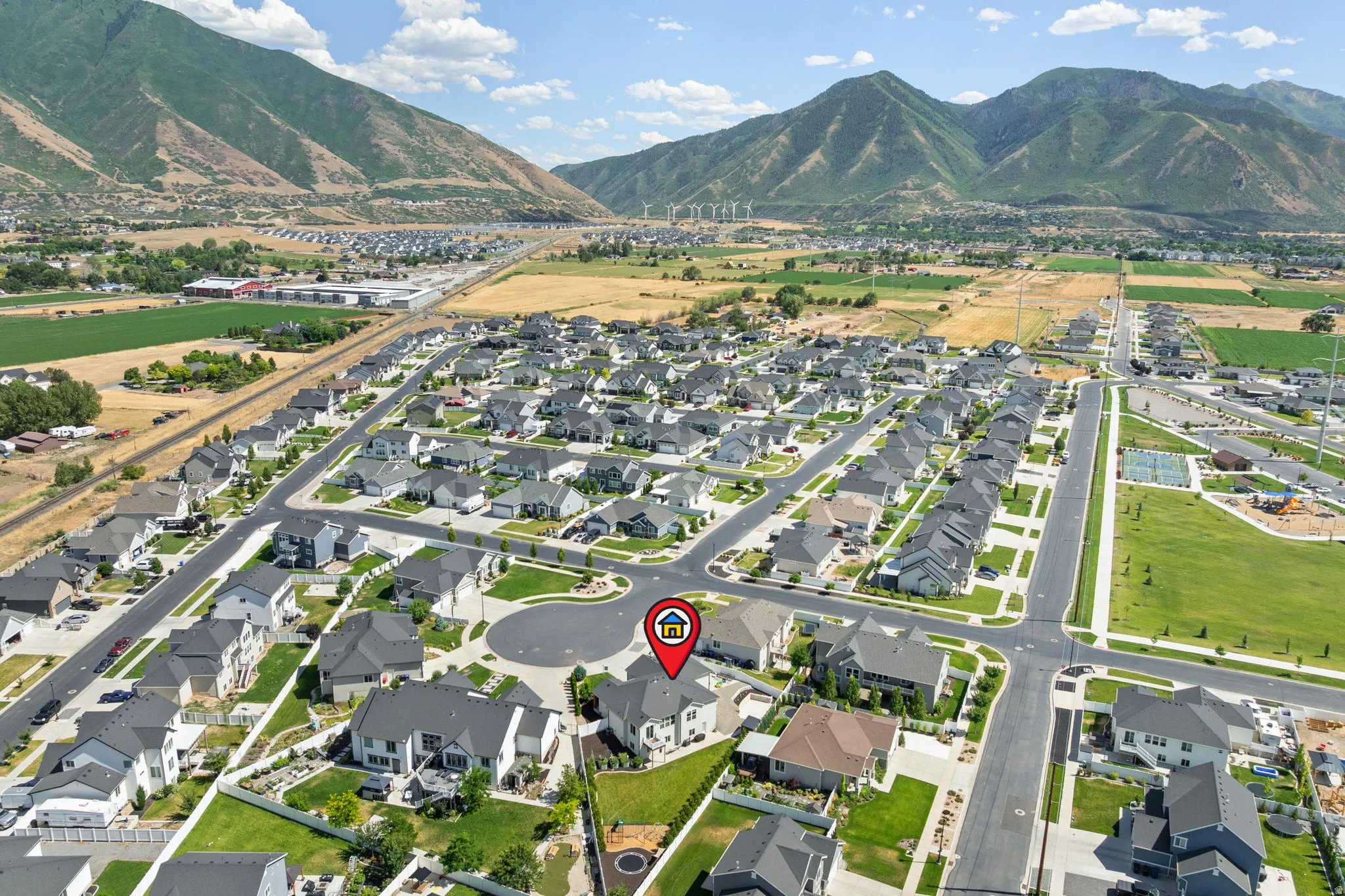 Aerial perspective showcasing a residential community with mountain scenery