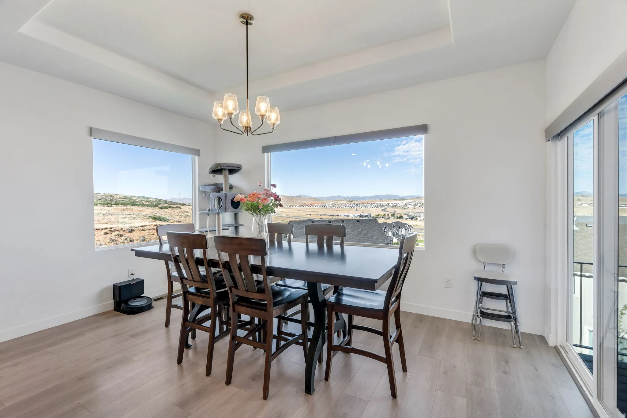 Dining area featuring large windows and sliding glass door to covered deck!