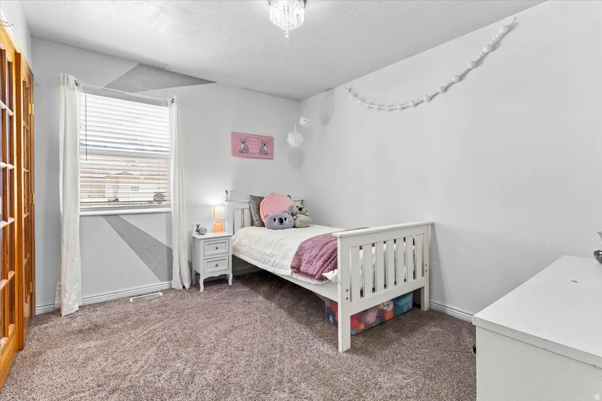 Plush carpeting complements the bright white walls and ceiling