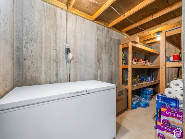 Concrete walls with exposed wood ceiling beams