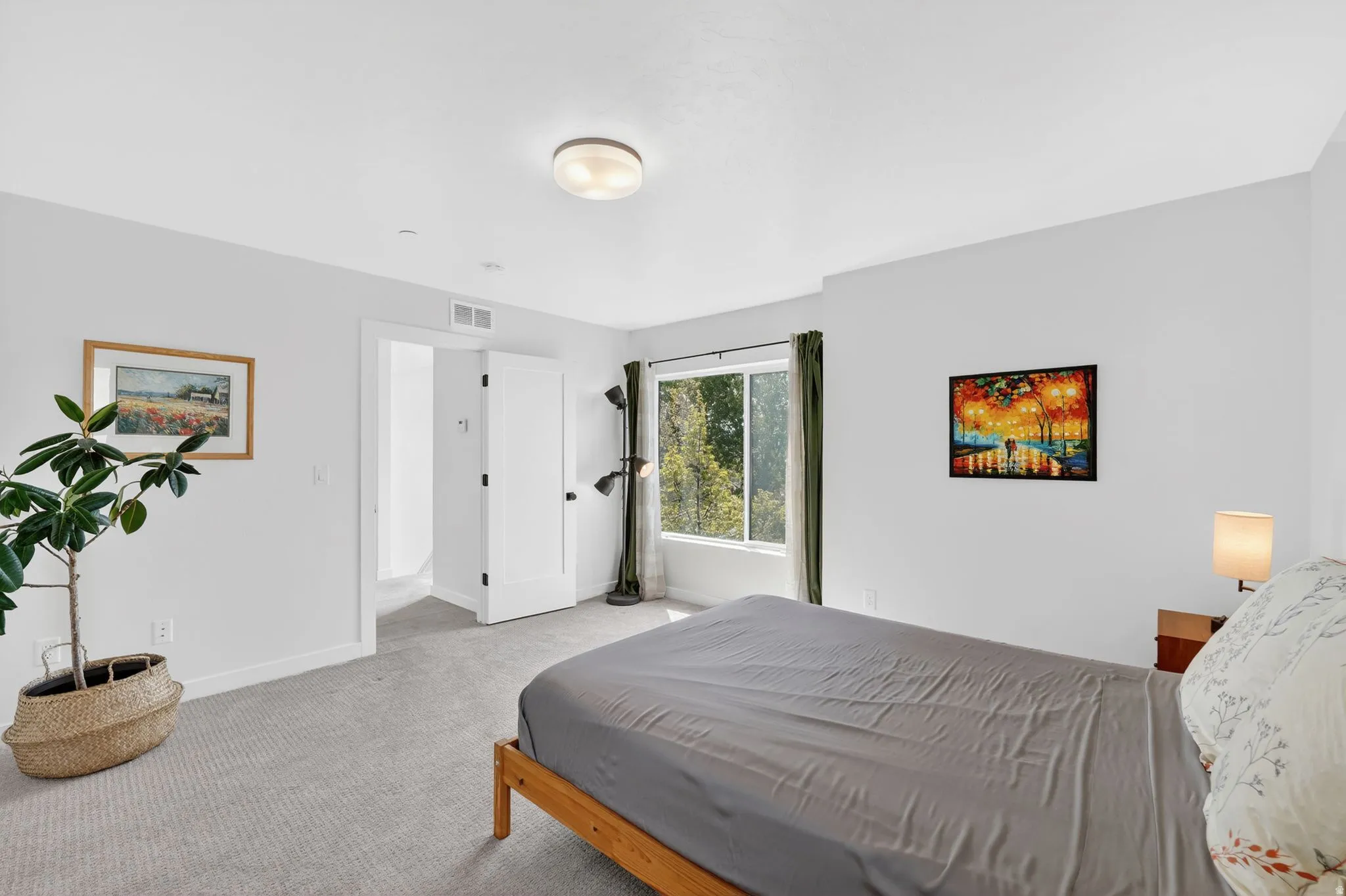 Bright interior space with light gray carpet and white walls