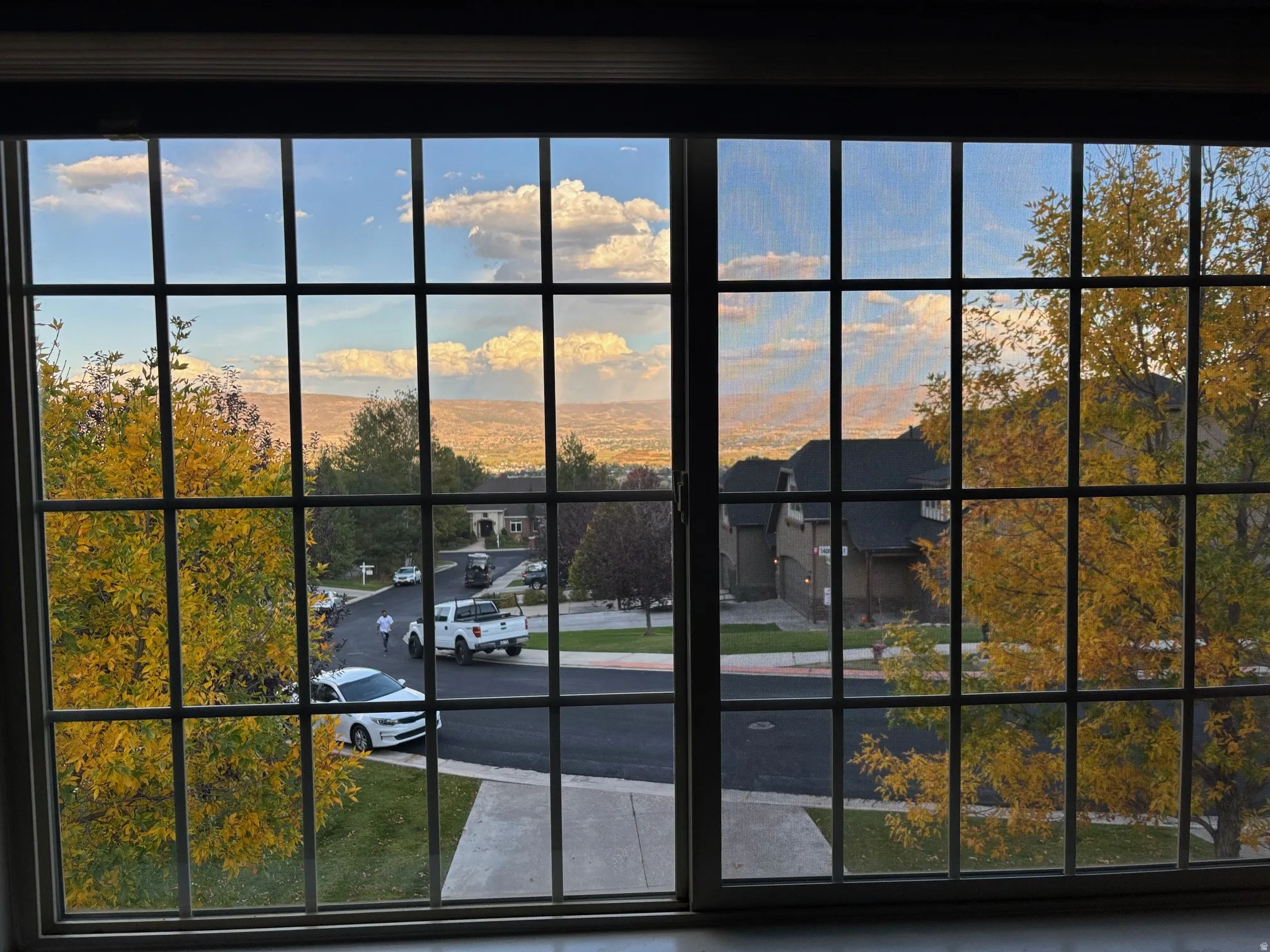 Large grid-pattern window offering expansive sky and distant landscape view of Midway-Heber Valley