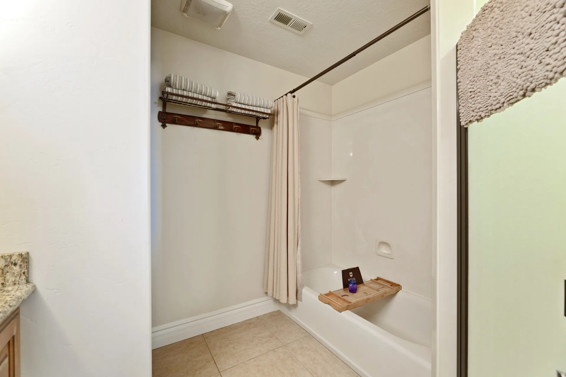 Full-size bathtub/shower plus a separate 2nd shower; Granite counters, duel sinks;