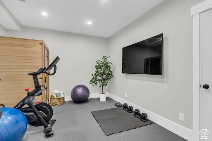 Dedicated fitness space featuring recessed lighting and gray carpeting.  Recently added.