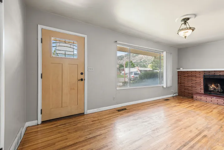 Hardwood flooring extending throughout the space