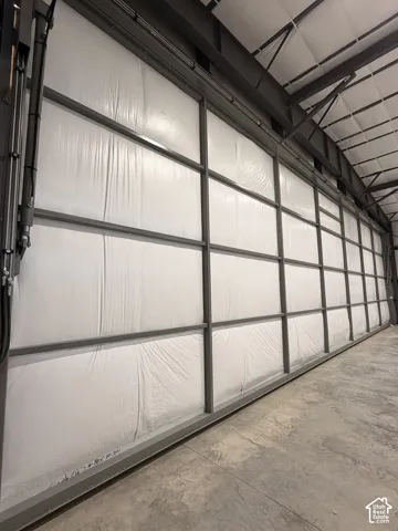 Industrial-grade wall system featuring a robust metal framework and white paneling