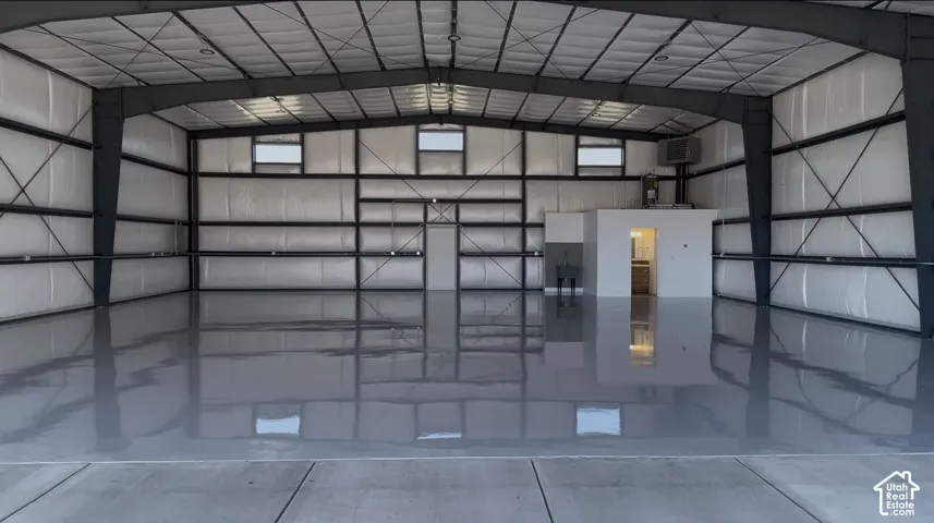 Spacious interior with polished concrete flooring and exposed steel beam construction