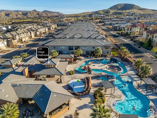Expansive resort-style pool area featuring a lazy river, multiple swimming zones, and an integrated spa