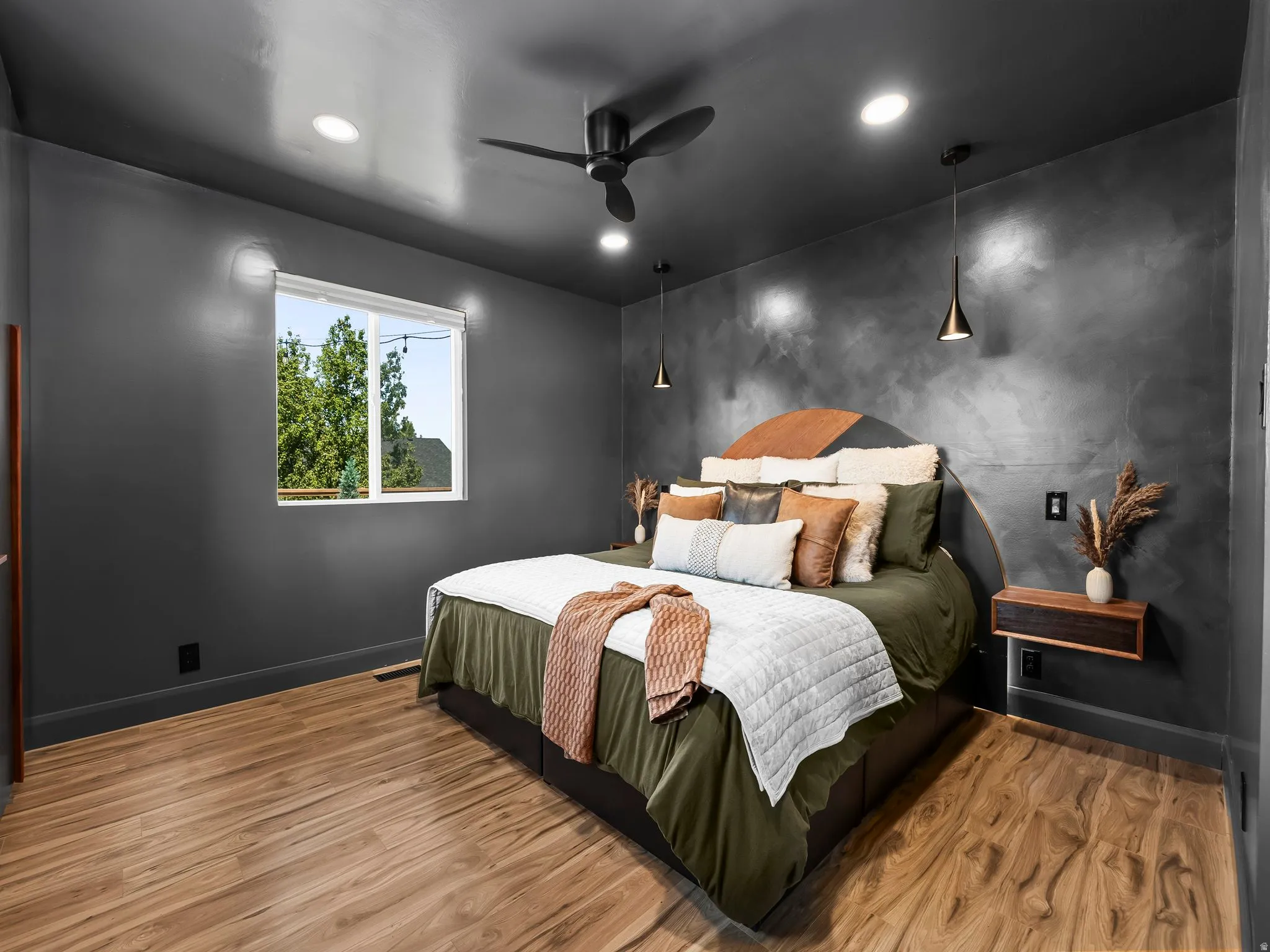 Room featuring wood-finish flooring, a contemporary ceiling fan, and recessed lighting