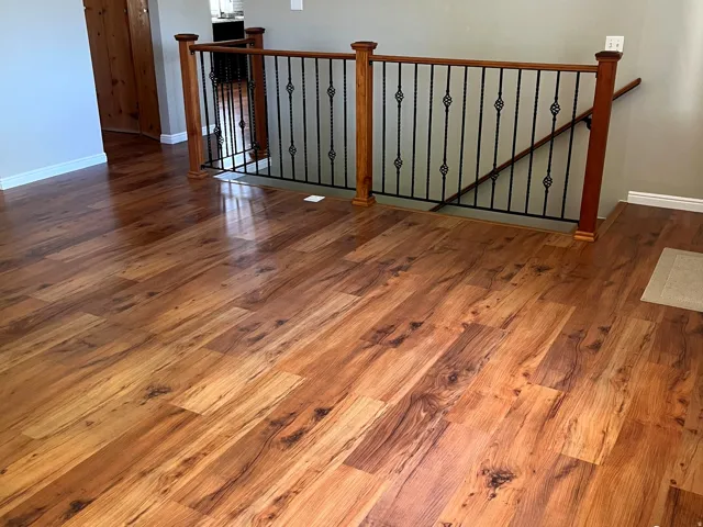 Rich wood-finish flooring extending throughout the space