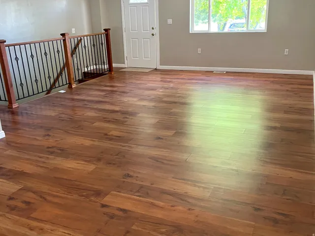 Spacious living area featuring wood-finish flooring and neutral wall tones