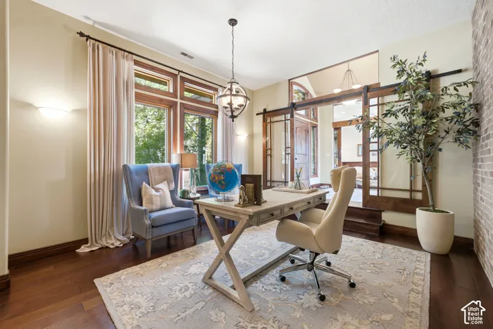 Hardwood flooring throughout the room, complemented by a decorative area rug
