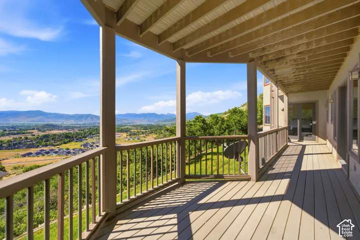 Spacious covered deck with panoramic mountain and valley scenery