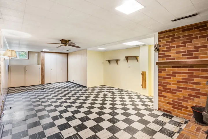 Spacious interior featuring checkerboard tile flooring