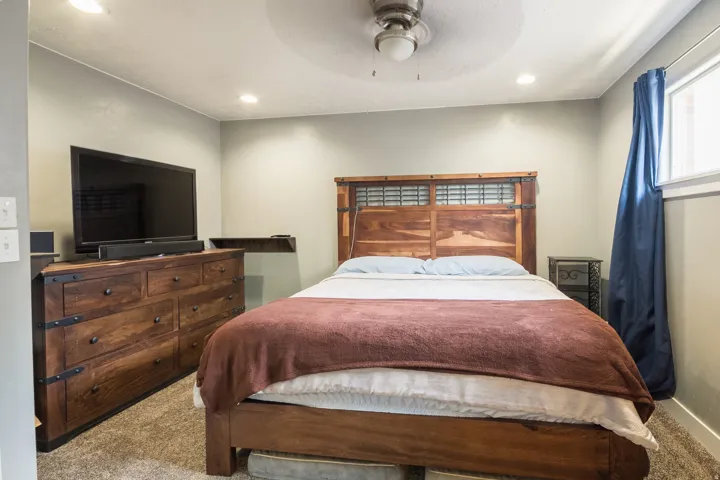Bedroom featuring neutral wall paint, recessed lighting, and a ceiling fan