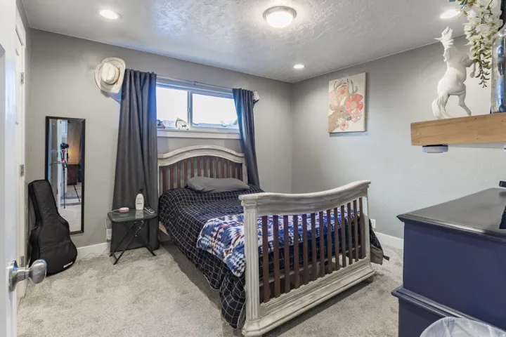 Carpeted room with a window, recessed lighting, and a ceiling-mounted fixture