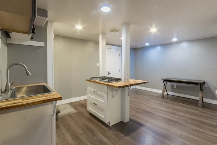 Open concept living space featuring wood-finish flooring, recessed lighting, and a neutral wall palette