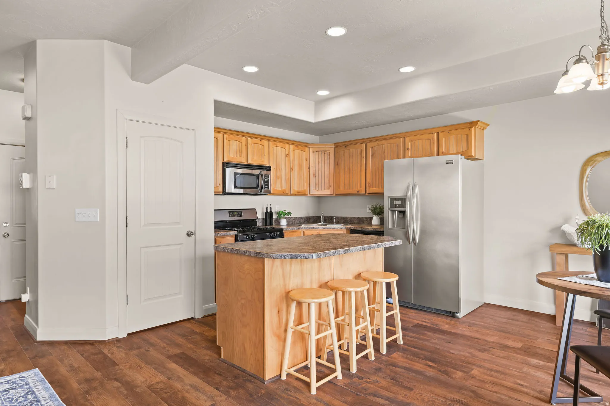 Open-concept living space featuring kitchen bar