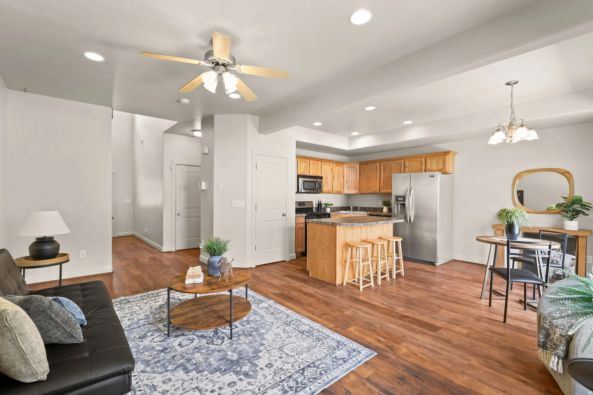 Open-concept living space featuring kitchen bar