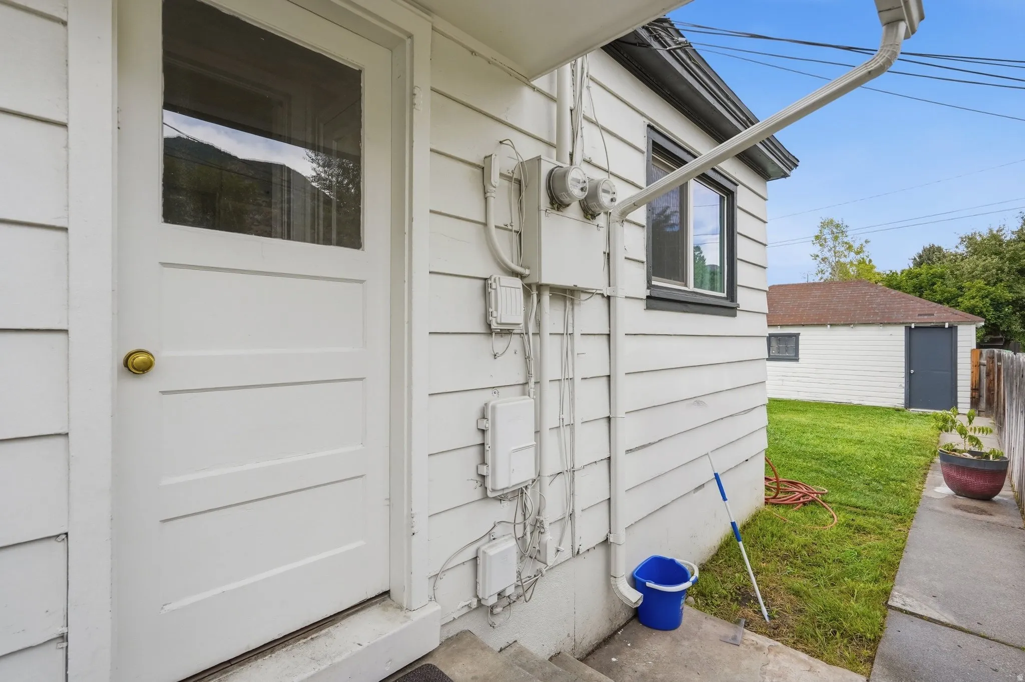 White paneled exterior door with upper glass panel