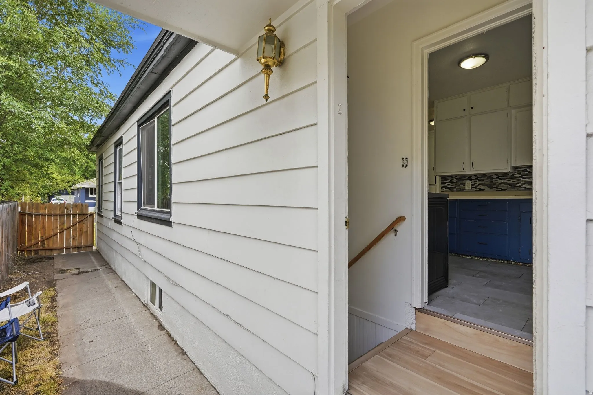 Crisp white siding with dark trim windows