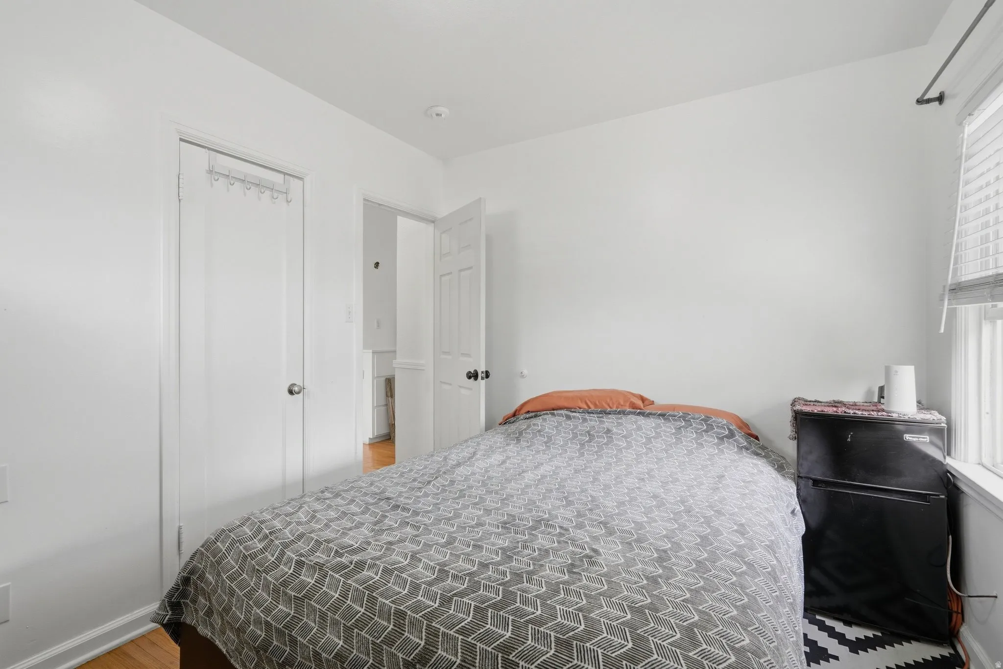 Bedroom #3 White walls with recessed lighting and wood-finish flooring