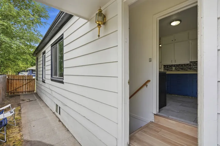 Crisp white siding with dark trim windows