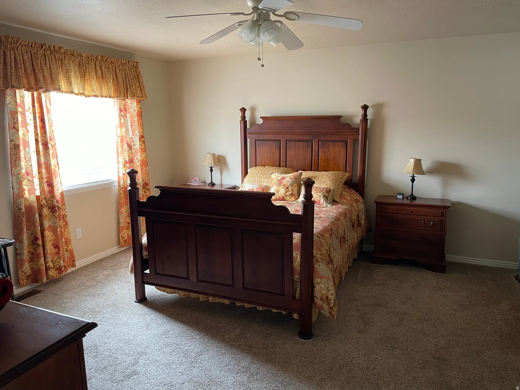 Bedroom featuring a window with blinds, a ceiling fan, and carpeted flooring