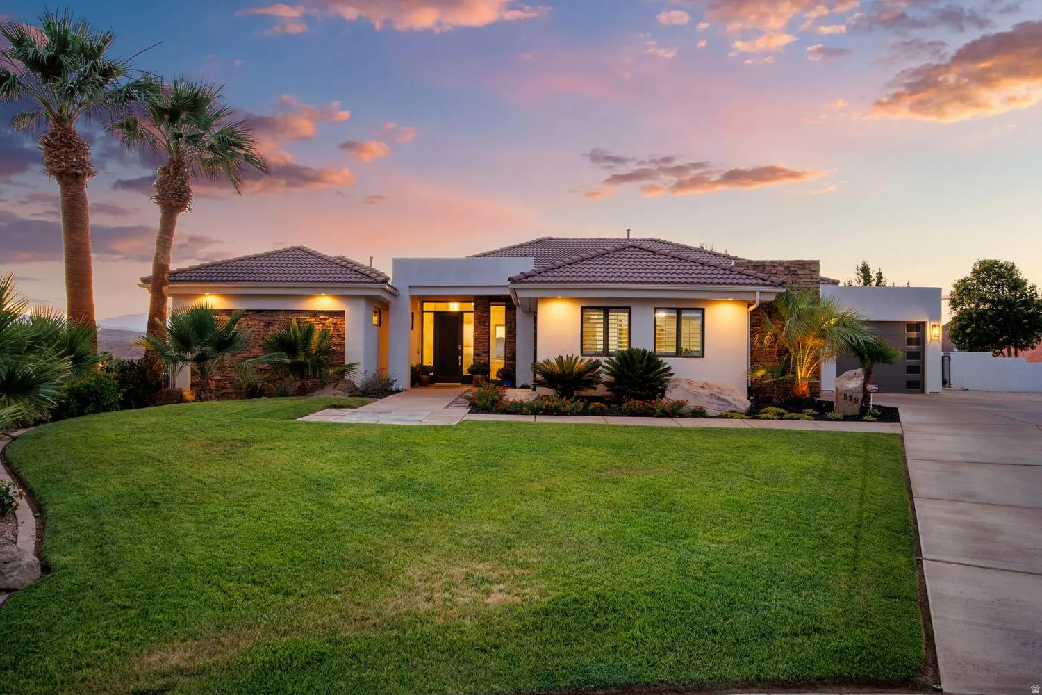 Contemporary exterior with a tiled roof and integrated garage