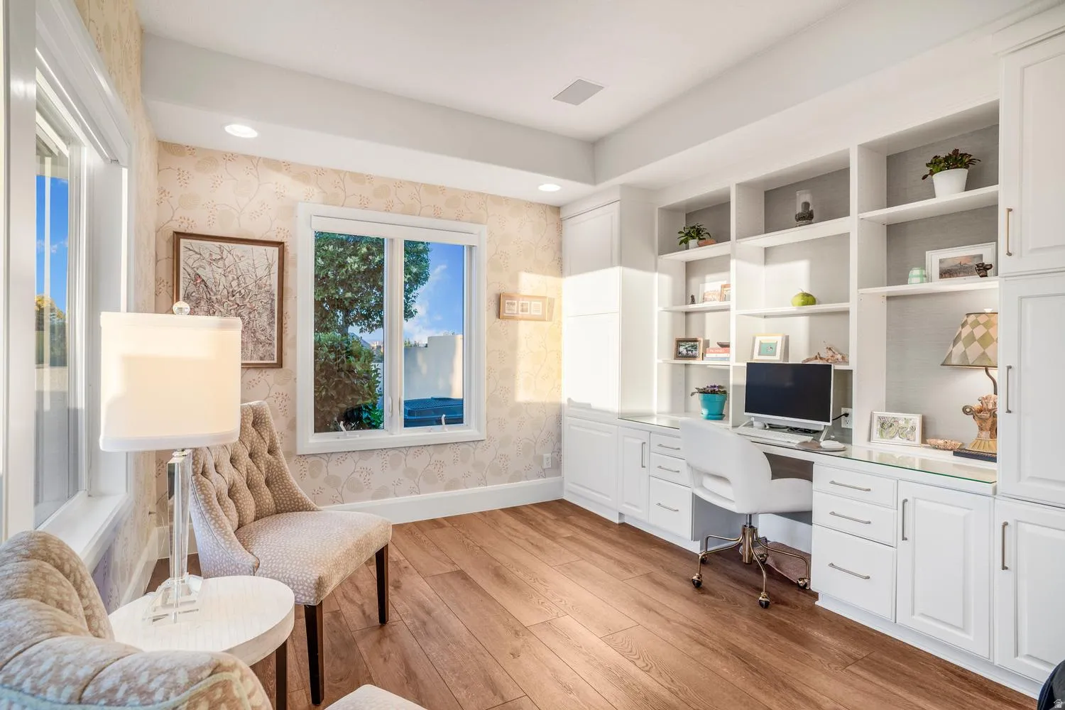 Custom built-in desk and shelving unit featuring white cabinetry