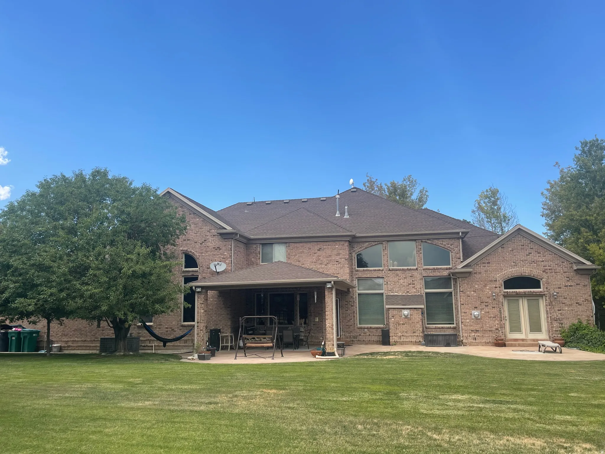 Brick exterior with a large, private backyard