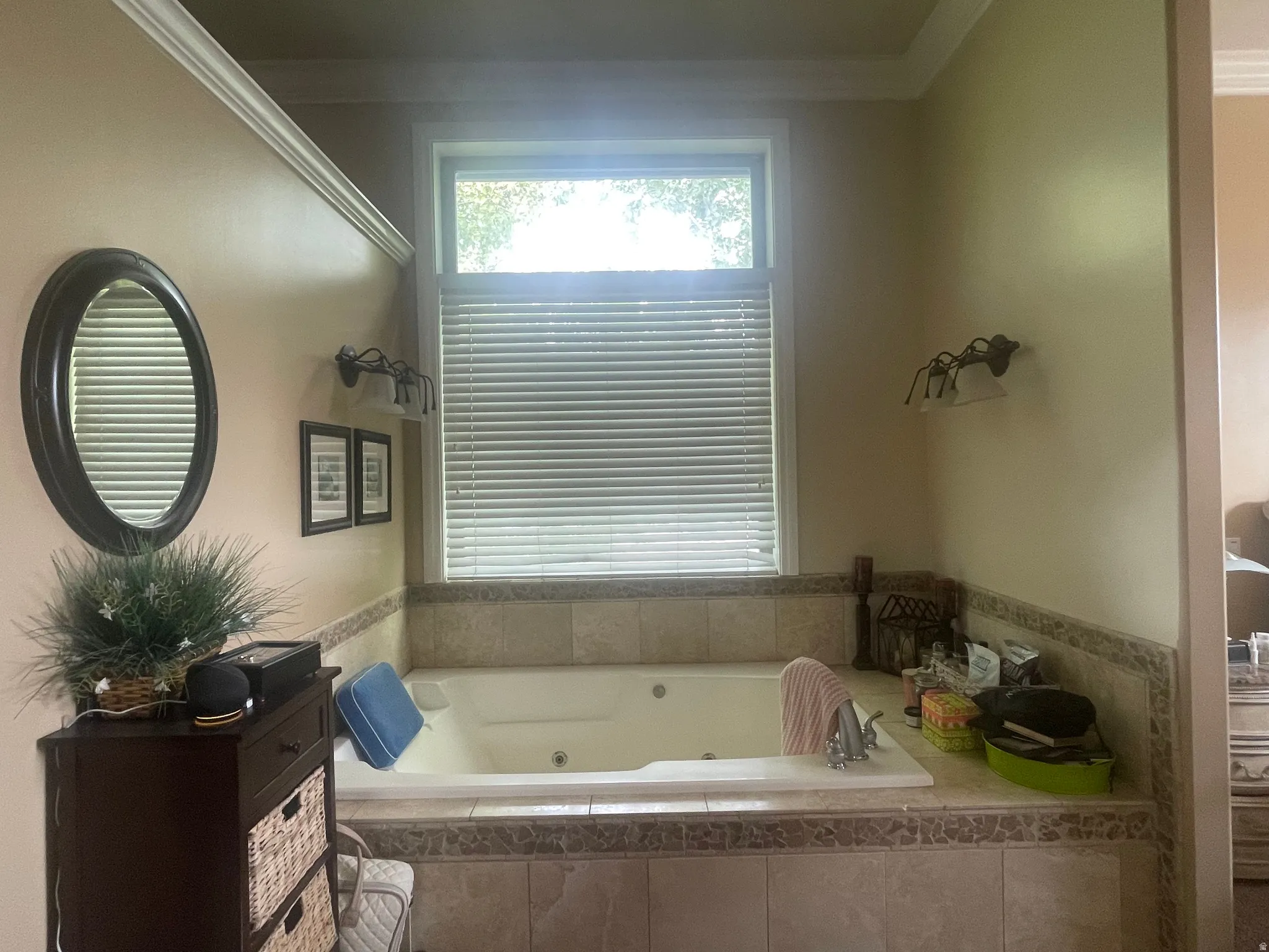 Soaking tub with integrated jets, surrounded by tile-finish decking and wainscoting