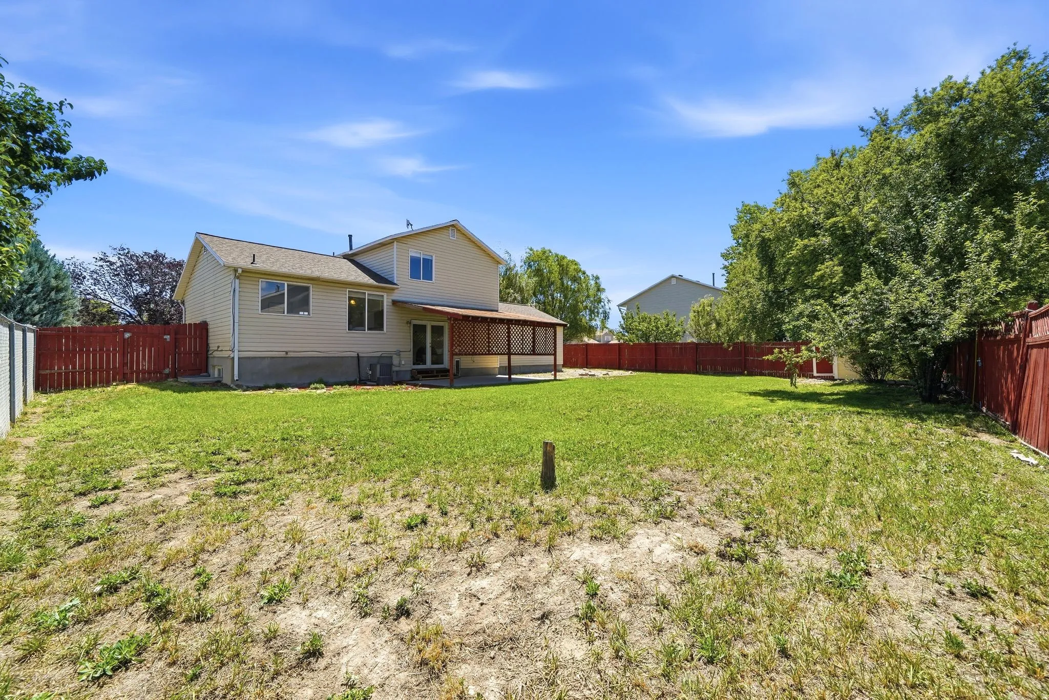 Expansive backyard with a full perimeter fence
