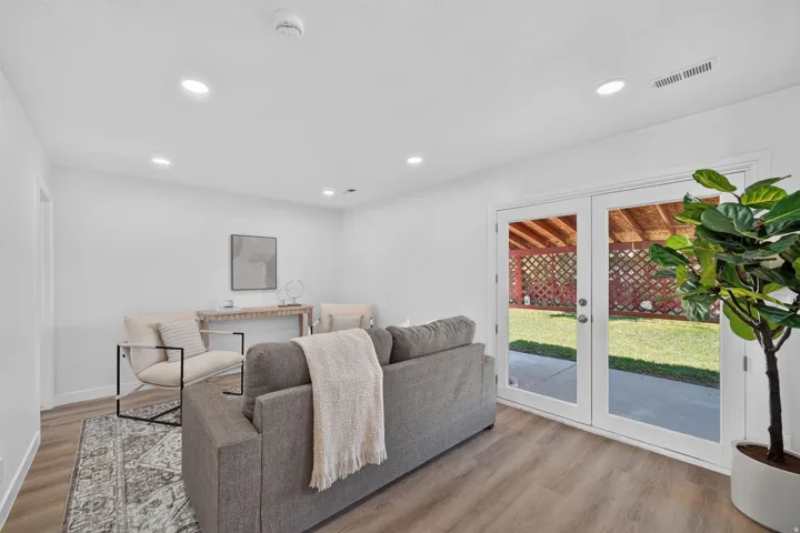 Bright interior space featuring white walls, recessed lighting, and wood-finish flooring