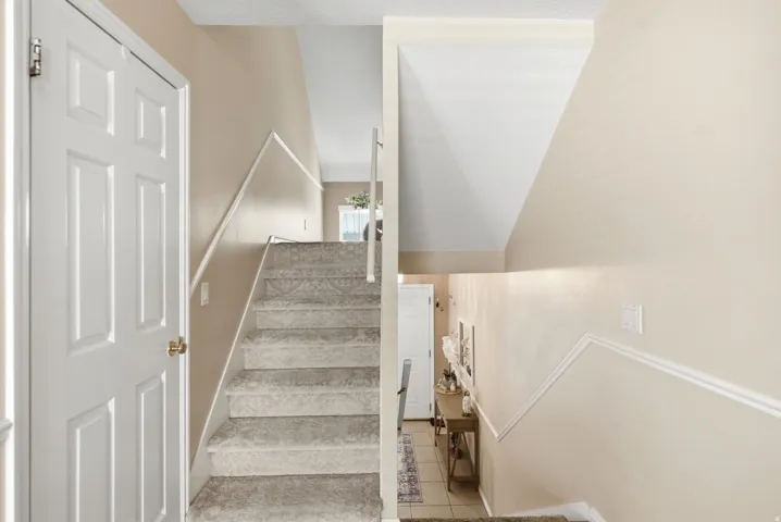 Carpeted staircase to loft and 2nd Primary Bedroom