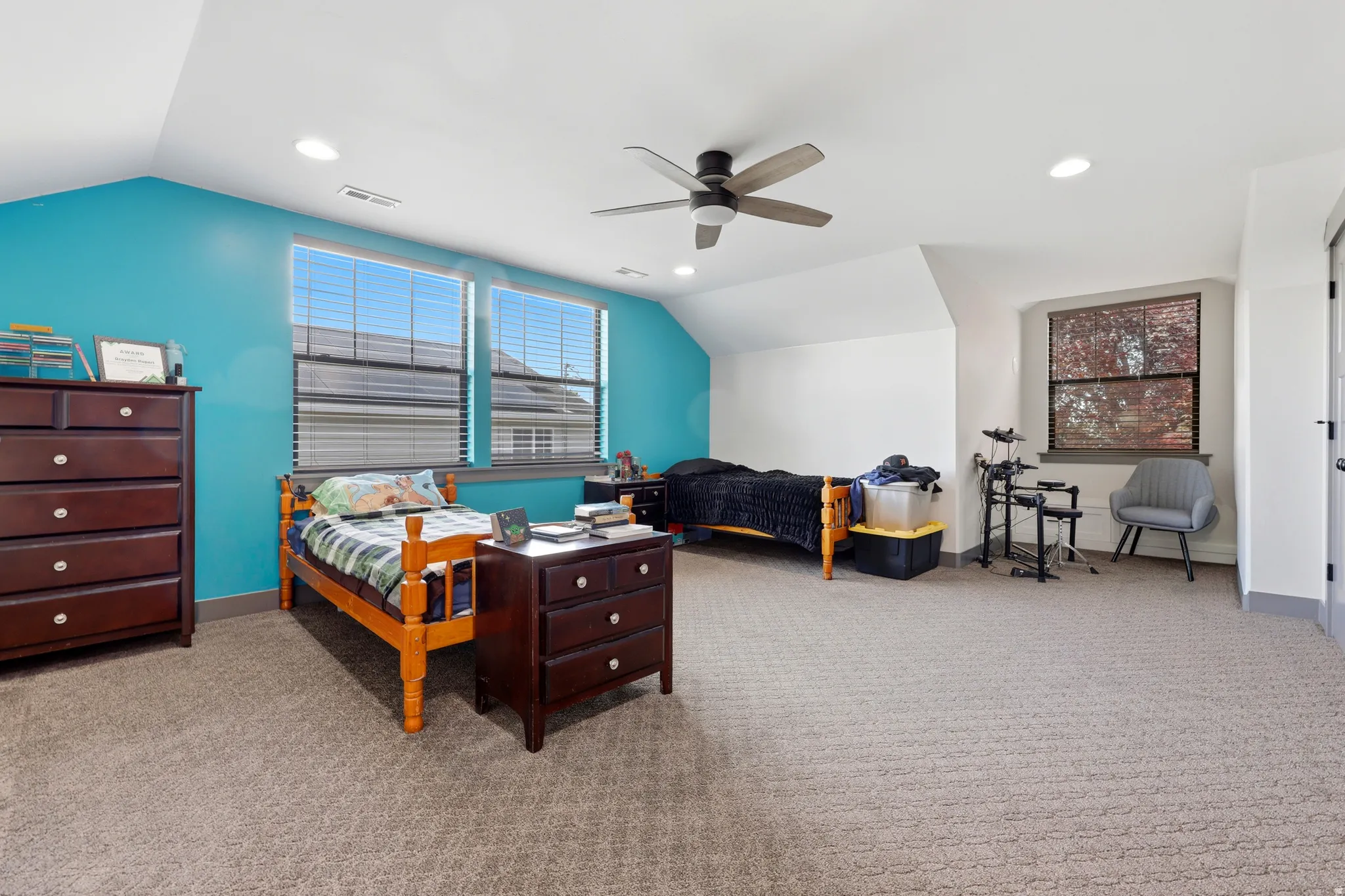 18x15 bedroom with double closets, recessed lighting, and a ceiling fan