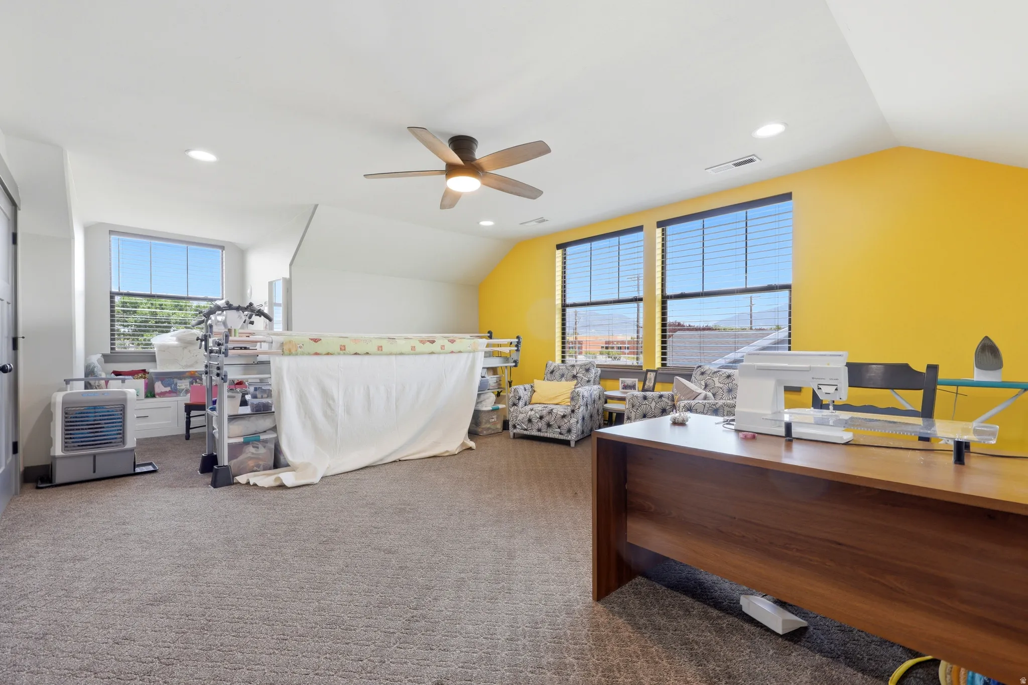 18x15 bedroom with double closets, recessed lighting, and a ceiling fan