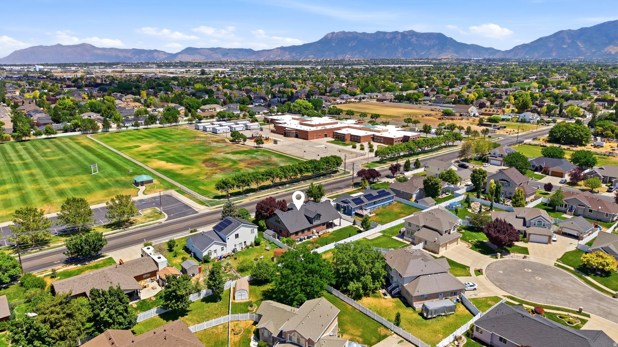 Residential neighborhood featuring a cul-de-sac and mountain backdrop