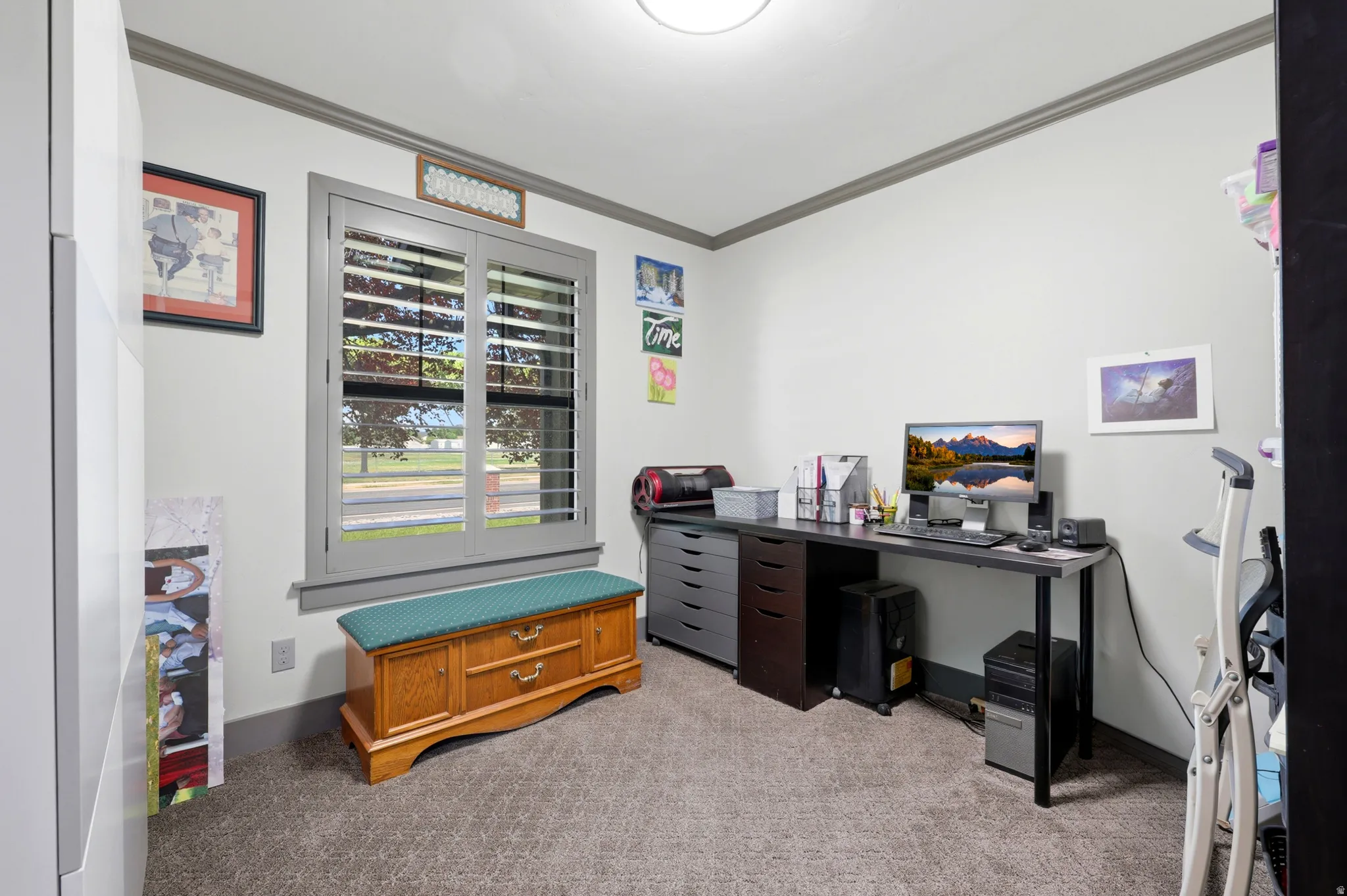 Room featuring a window with integrated shutters, neutral wall finishes, and a textured carpet
