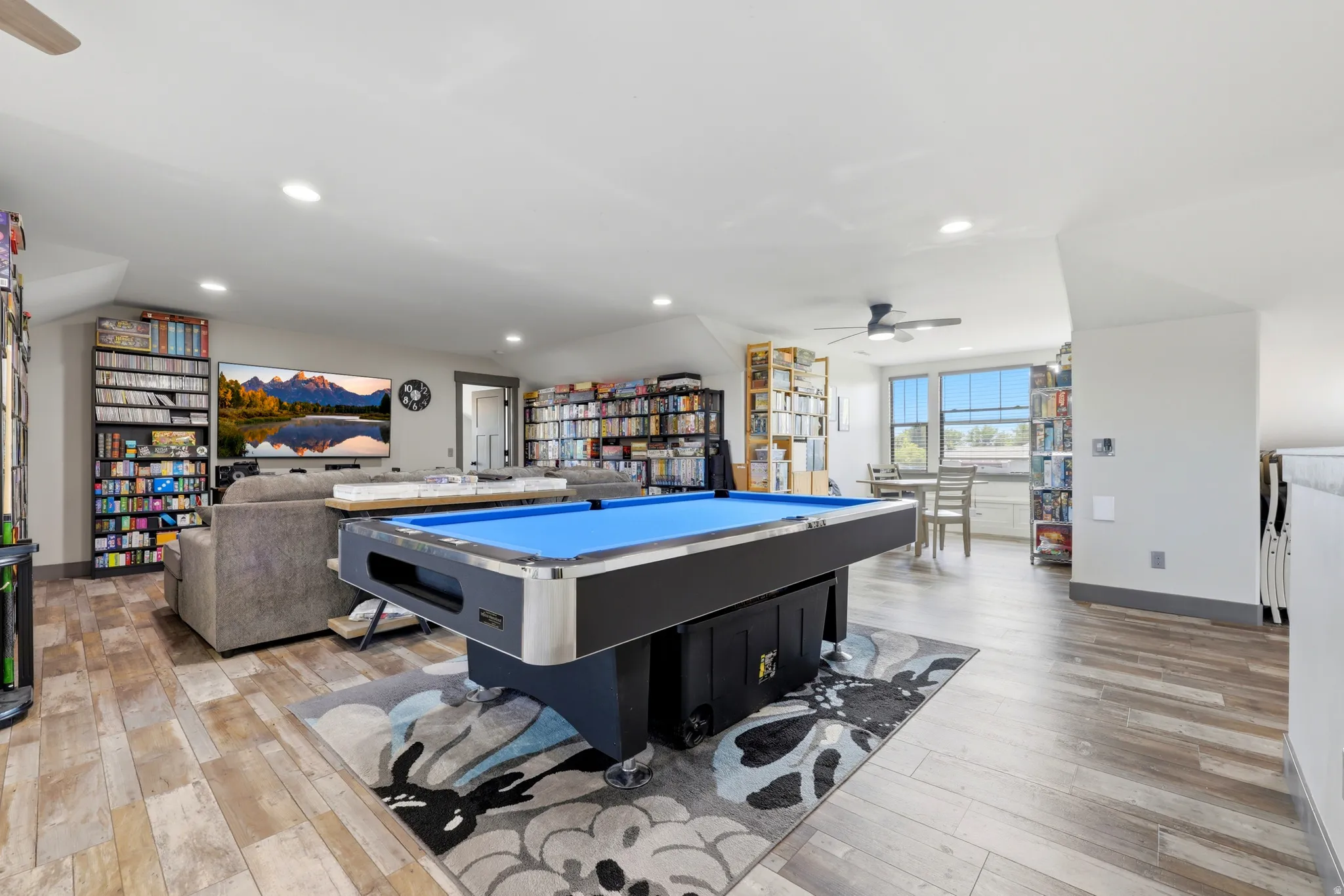 Spacious bonus room featuring wood-finish flooring, recessed lighting, and a ceiling fan