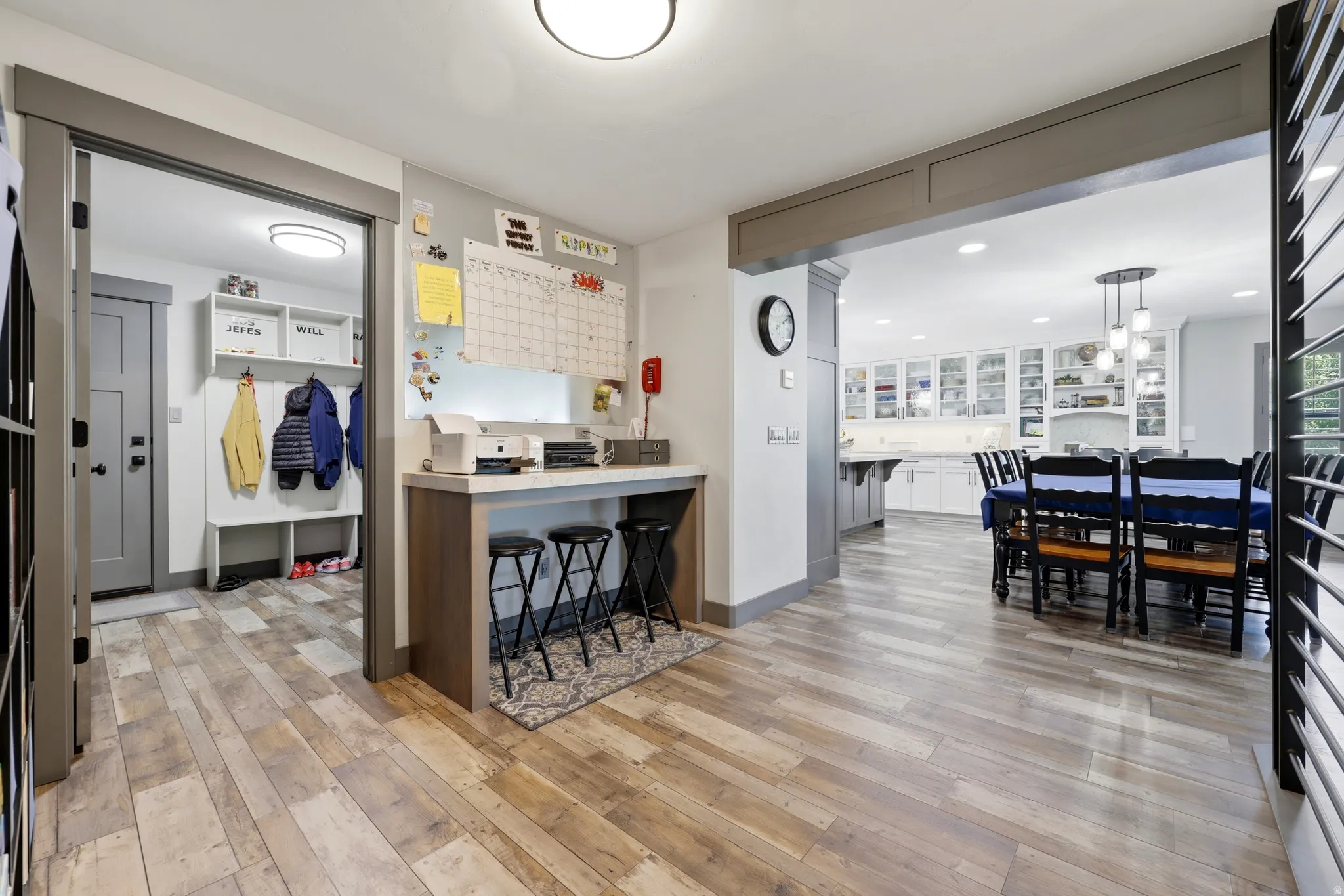 Open concept interior featuring wide plank wood-finish flooring