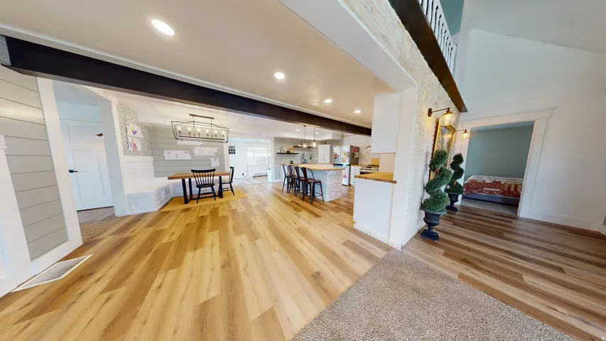 Open concept interior featuring wood-finish flooring throughout