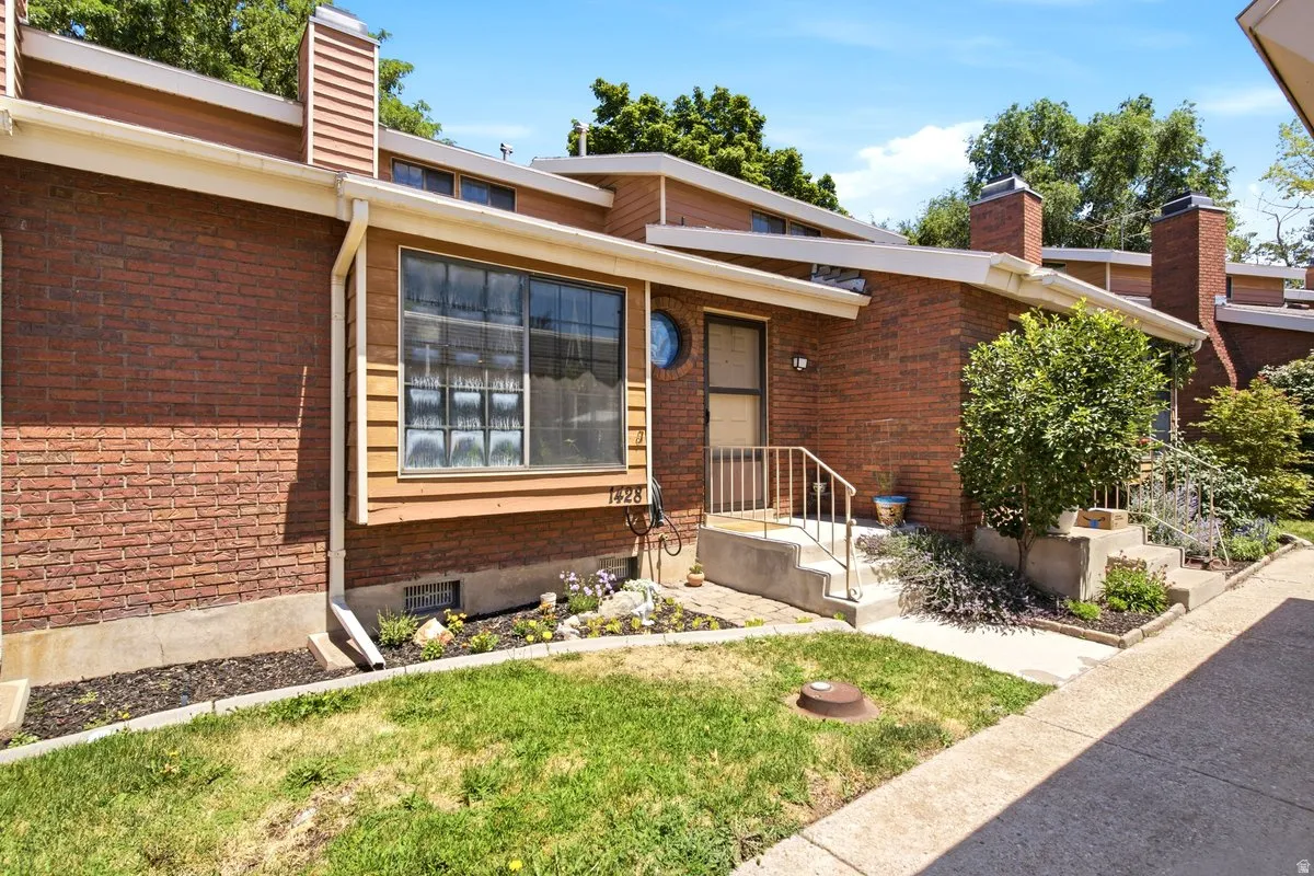 Brick exterior with a prominent window featuring glass block accents