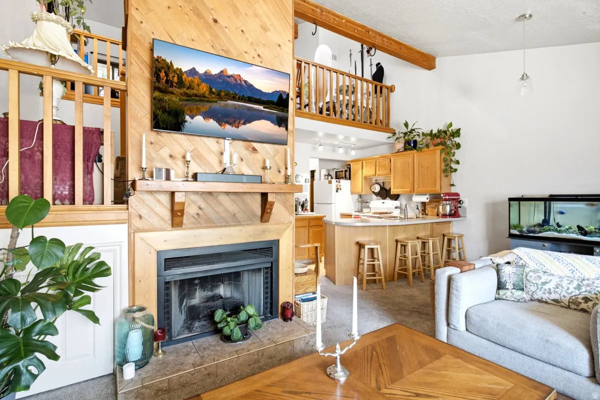 Central fireplace with a wood-paneled surround and mantel