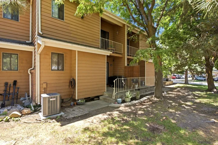 Two-story exterior with horizontal siding and multiple windows