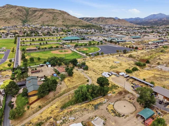 Mountain backdrop with extensive green spaces and residential areas